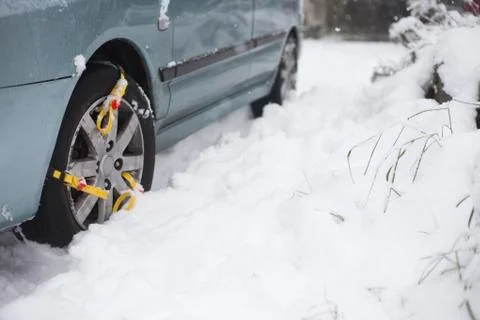 Chains on tire in the snow Stock Photos