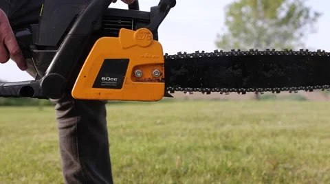 Chainsaw closeup idling Stock Footage 64221795