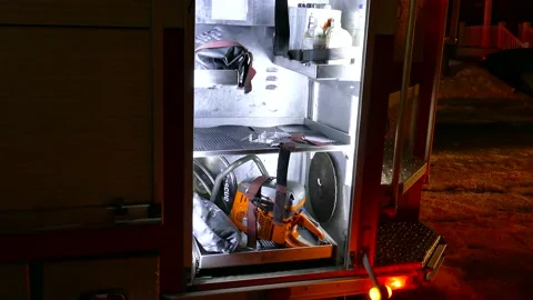 Chainsaw in firetruck drawer Stock Footage 139663859