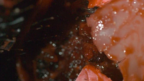 Chainsaw ripping into flesh-like object Stock Footage 127947894
