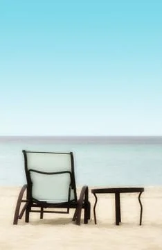 Chair and Table on the Beach Stock Photos