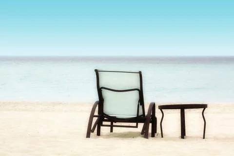 Chair and Table on the Beach Stock Photos