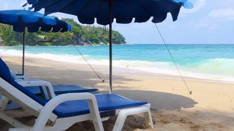 Chair and Umbrella at Karon Beach, Phuket, Thailand on a beautiful day. Stock Footage