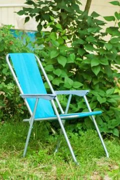 Chair in backyard empty space and green plants natural environment Stock Photos