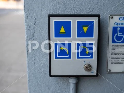 Chair lift accessibility control panel for wheelchair handicap machine into Stock Photos