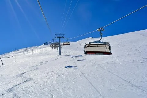 A Chair Lift in the Alps with sunshine Stock Photos