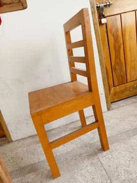 A chair lying inside an empty building Stock Photos