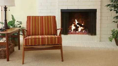 Chair next to fireplace 스톡 동영상 9380524