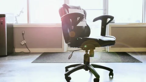 A chair sitting in front of a window Stock Footage 155533131
