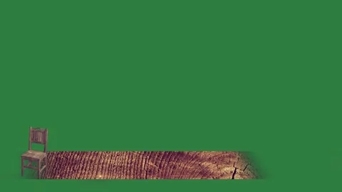 Chair sitting on top of in front pile wood piece it isolated isolated on green Stock Footage 336890335