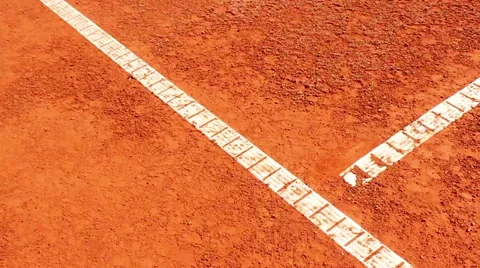 Chair umpire checking mark on clay court Stock Footage 40596407