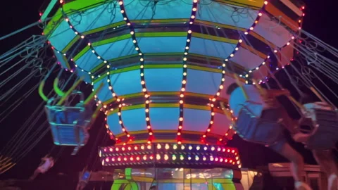 Chairoplane slow motion in a amusement park in Italy Stock Footage 239052465