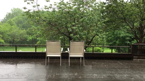Chairs and raining Stock Footage 135088972