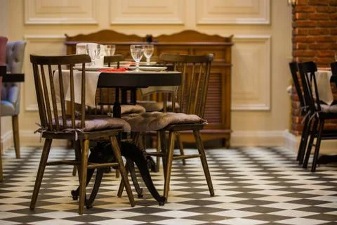 Chairs and sofas in a cafe on the table of glasses Stock Photos