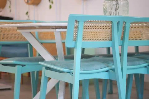 Chairs and table in a dining area with simple design Stock Photos