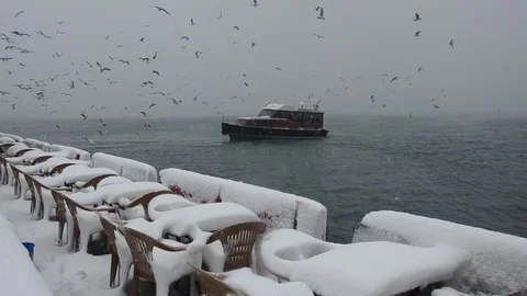 Chairs and table made from snow at Ski bar during snowfall in blizzard 스톡 동영상 81175529