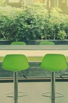 Chairs and table at window Stock Photos