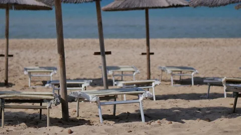 Chairs and umbrellas on the sandy beach of Sicily, Italy. Stock-Footage 95843005