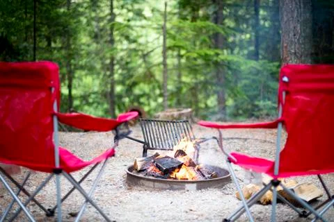 Chairs around the campfire Stock Photos