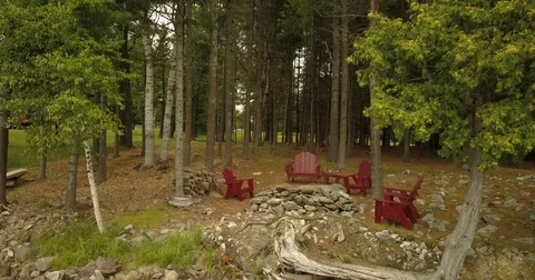 Chairs Aroung a Fire Pit in the Woods Video stock 81163518