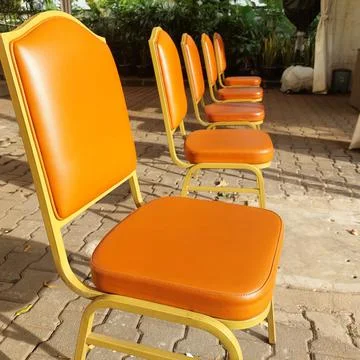 Chairs arranged for the queue of visitors Stock Photos