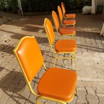 Chairs arranged for the queue of visitors Stock Photos
