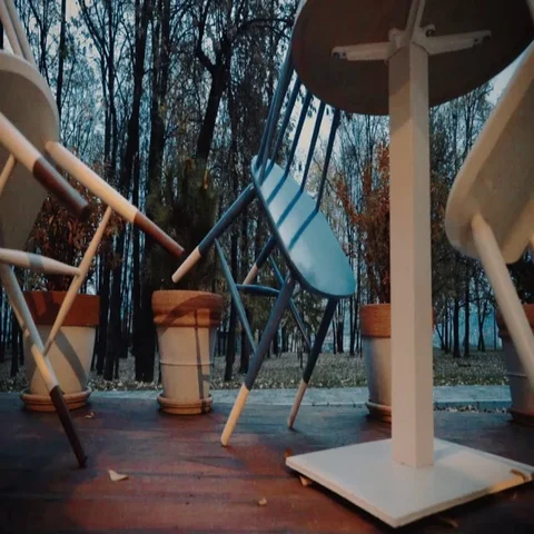 Chairs leaned upon a table. Closing time. Stock Footage 69322465