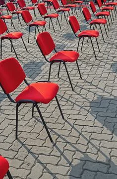 Chairs located are on square Stock Photos