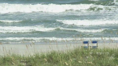 Chairs by the ocean waves Stock Footage 42010820