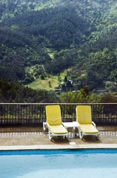 Chairs by the pool Stock Photos