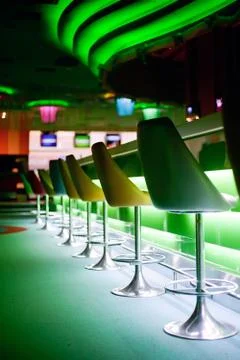Chairs in row in bar Stock Photos