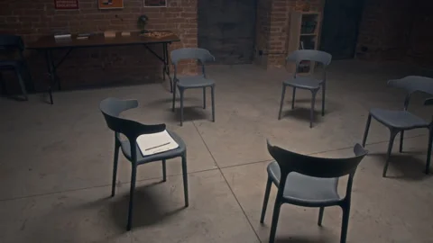 Chairs Set Up in Circle in Prison Hall for Group Therapy Session Видео 314053501