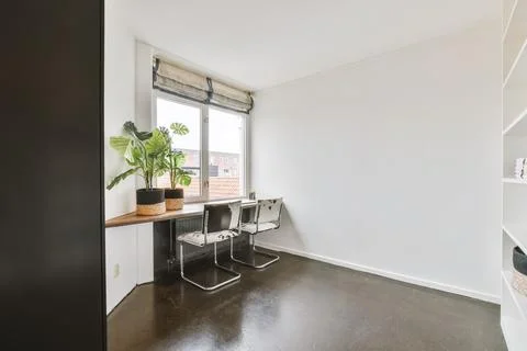 Chairs at table in study room Stock Photos