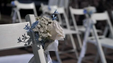 Chairs for the wedding ceremony with decorative elements with fresh flowers Stock Footage 309700998