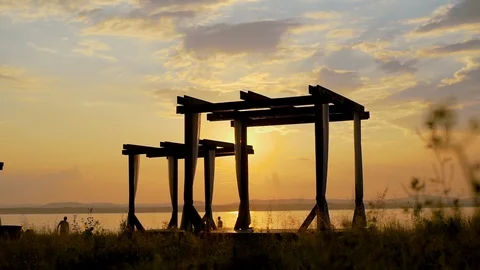 Chaise with canopy against the beautiful sunset Stock Footage 102380060