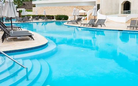 Chaise lounge by the pool Stock Photos
