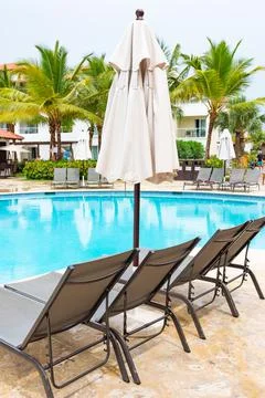 Chaise lounge by the pool Stock Photos