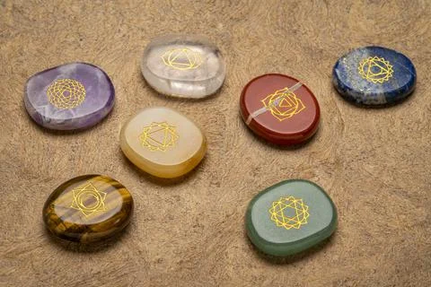 Chakra stones with symbol engraving Stock Photos
