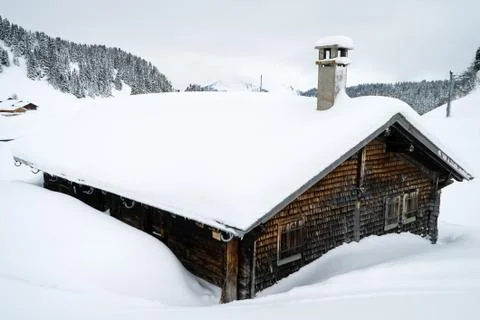 Chalet covered with snow Stock-Fotos