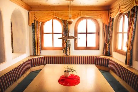Chalet interior table with window light beams mountain lodge relaxing lifesty Stock Photos