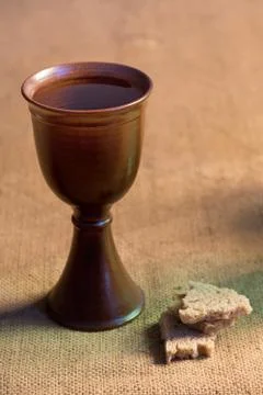 Chalice Of Wine With Bread On The Table Stock Photos