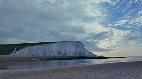 Chalk Cliffs and Tide-Lined Pebble Beach in Coastal England — Still Windy Day Stock Footage 309767480