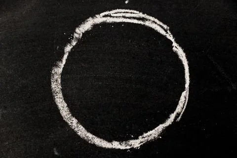 Chalk drawing as circle shape as blank stamp or seal on blackboard background Foto stock