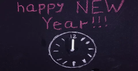 Chalk drawing on the clock Board and the inscription happy New year Stock Footage 140504292