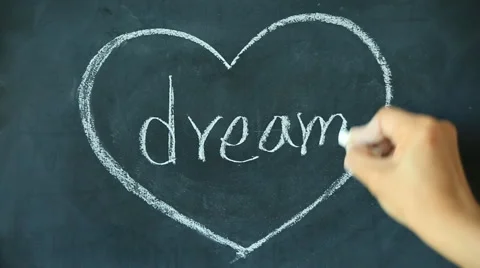 Chalk drawing - Dream in heart shape on chalkboard Stock Footage 68113577