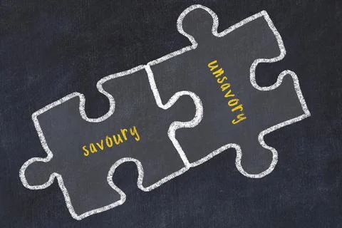 Chalk drawing of two puzzles with words savoury and unsavory. Concept of solv 스톡 일러스트