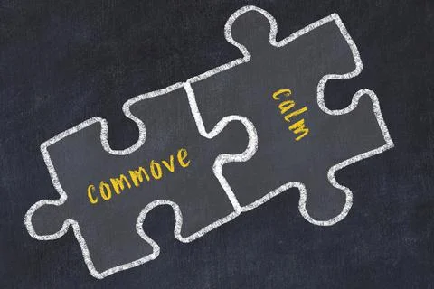 Chalk drawing of two puzzles with words commove and calm. Concept of solving  Stock Illustration