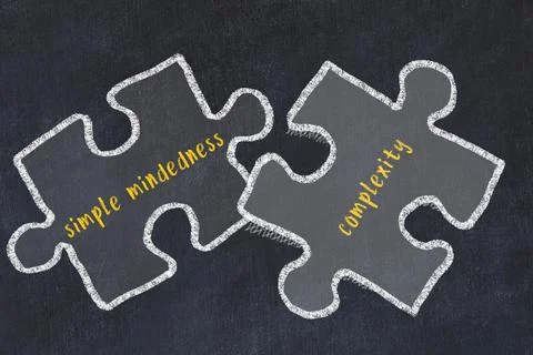 Chalk drawing of two puzzles with words simple mindedness and complexity. Con Stock Photos