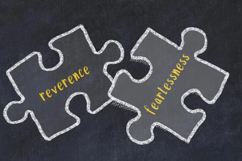 Chalk drawing of two puzzles with words reverence and fearlessness. Concept o 库存照片