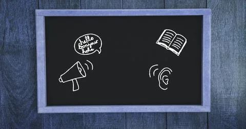 Chalk drawings on black background, featuring a book and megaphone Stock Photos